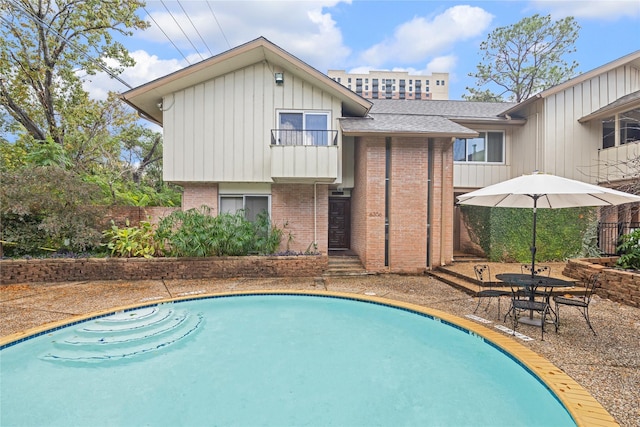 view of swimming pool featuring a patio