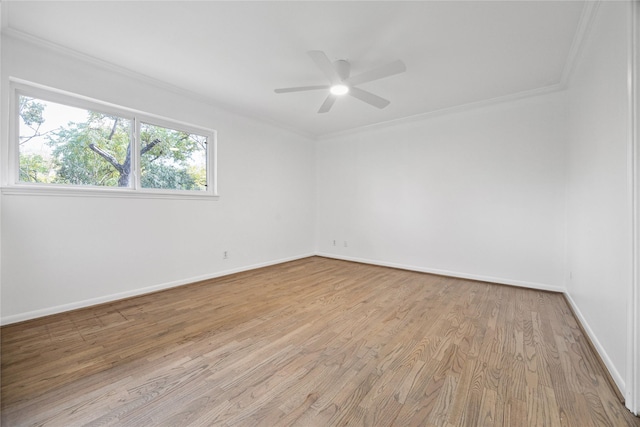 empty room featuring ceiling fan, ornamental molding, and light hardwood / wood-style flooring