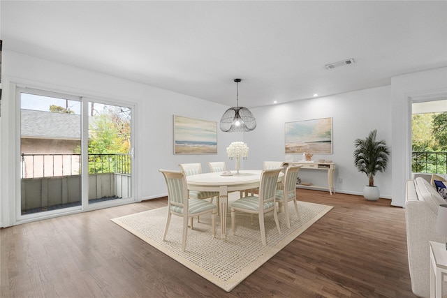 dining room with dark wood-type flooring