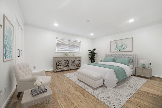 bedroom featuring ornamental molding and hardwood / wood-style floors