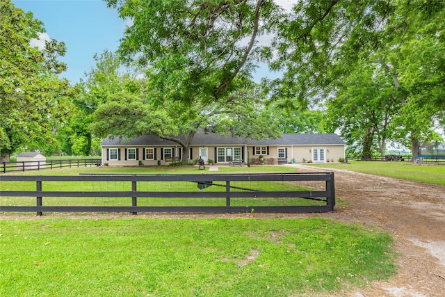 ranch-style house with a front yard