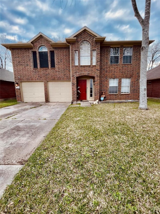 view of front of house featuring a front lawn and a garage