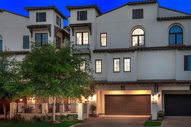 mediterranean / spanish house with a garage