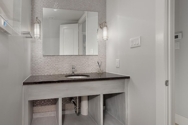 bathroom with vanity and backsplash