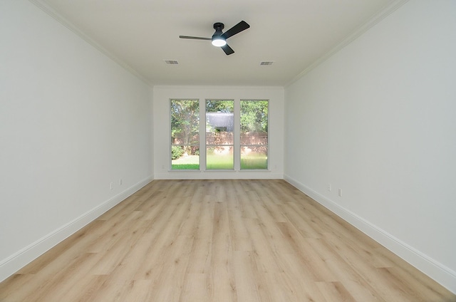 unfurnished room featuring ceiling fan, light hardwood / wood-style flooring, and ornamental molding