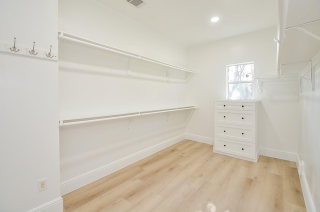 walk in closet featuring light hardwood / wood-style floors