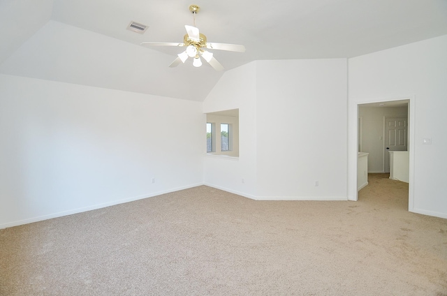 unfurnished room with light carpet, ceiling fan, and lofted ceiling