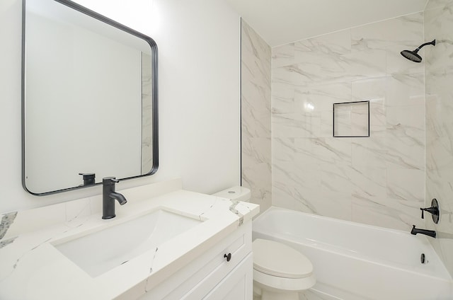 full bathroom with tiled shower / bath combo, toilet, and vanity