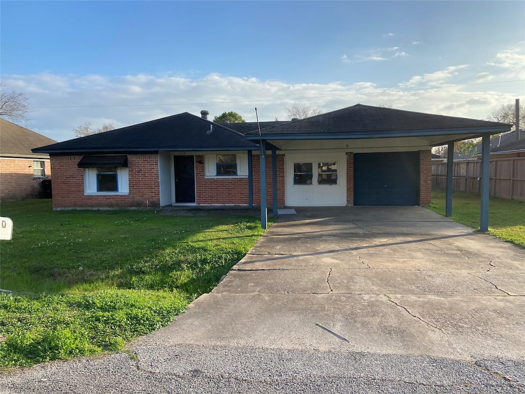 ranch-style home with a front yard and a carport