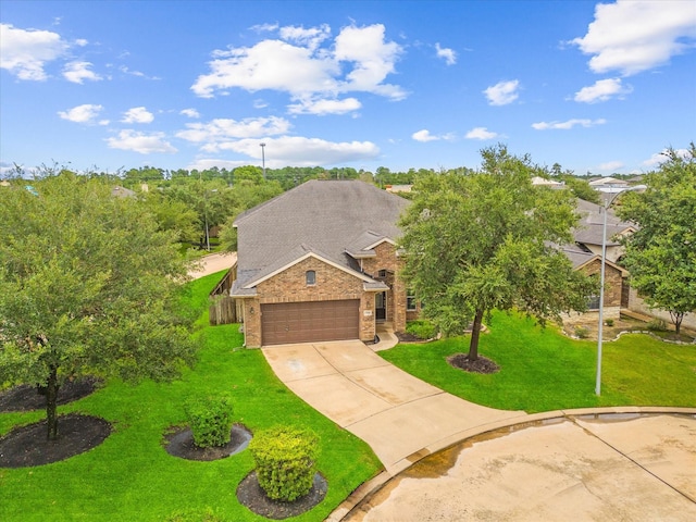 view of front of house featuring a front yard and a garage