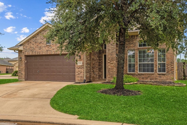 view of front of house with a garage and a front lawn