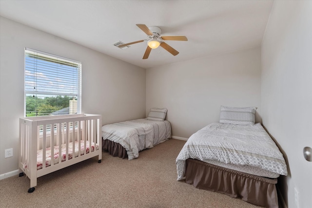 carpeted bedroom with ceiling fan