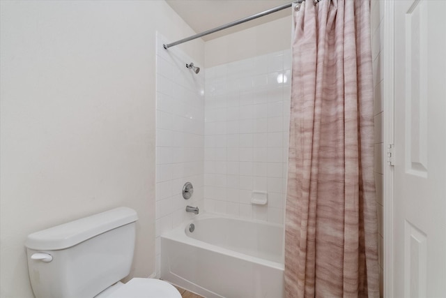 bathroom featuring toilet and shower / tub combo with curtain