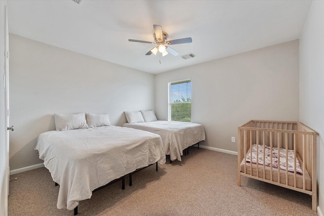 bedroom featuring ceiling fan and carpet floors