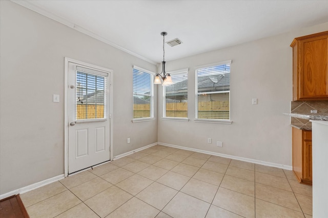 unfurnished dining area with light tile patterned flooring and a chandelier