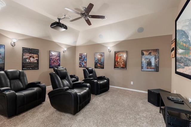 home theater room featuring carpet, a tray ceiling, ceiling fan, and lofted ceiling