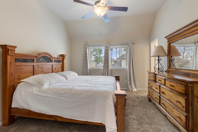 carpeted bedroom with ceiling fan and lofted ceiling