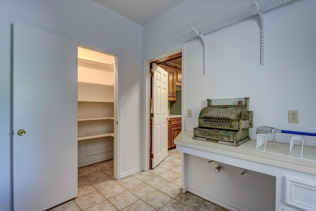 hallway with light tile patterned flooring