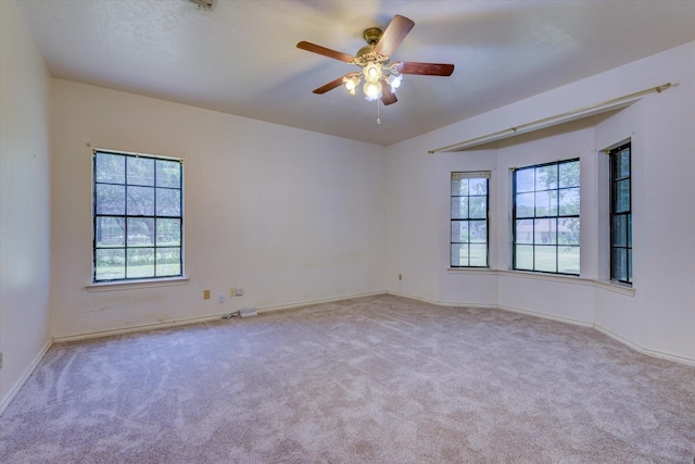 carpeted empty room with ceiling fan