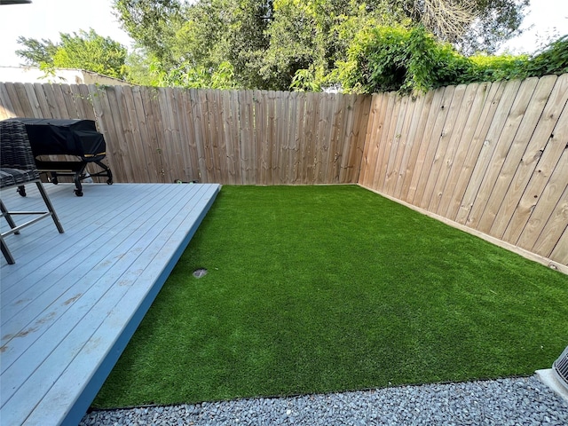 view of yard with a wooden deck