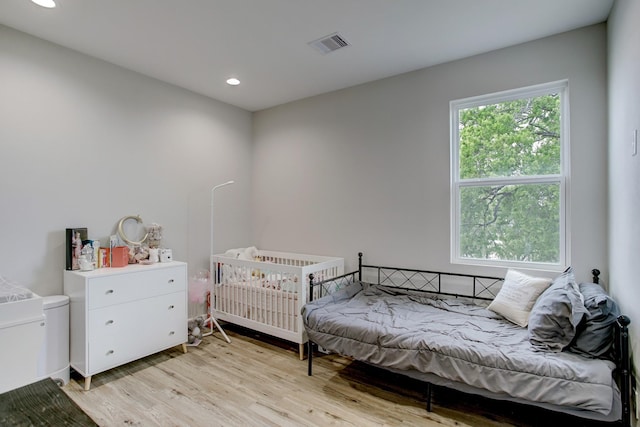 bedroom with light wood-type flooring