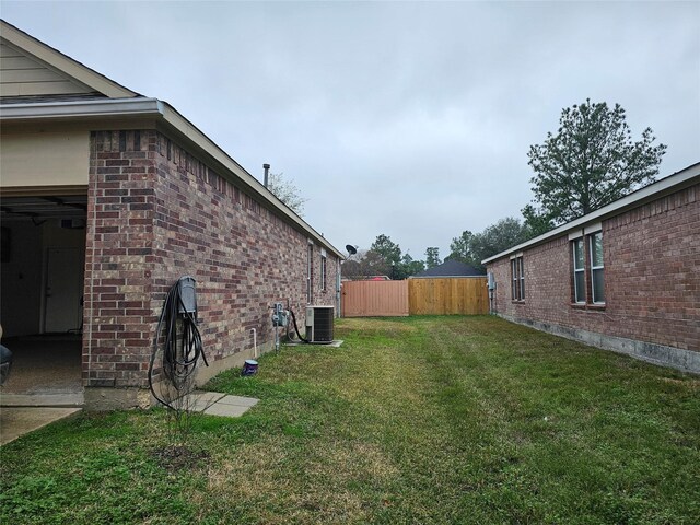 view of yard with central AC