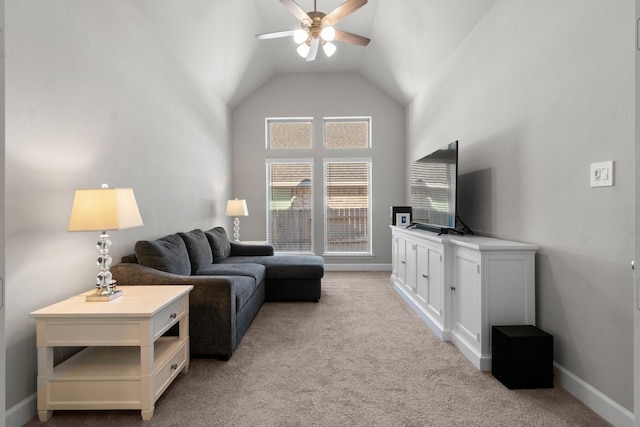 carpeted living room featuring ceiling fan and high vaulted ceiling