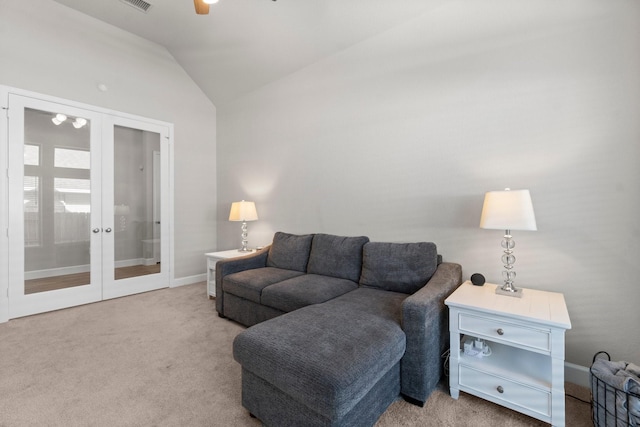 living room with light carpet, french doors, and lofted ceiling