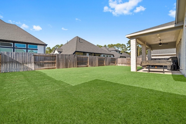 view of yard featuring ceiling fan