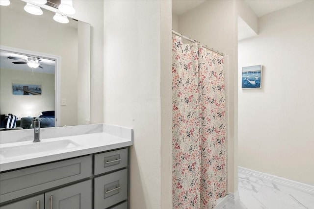 bathroom featuring a shower with shower curtain, vanity, and ceiling fan