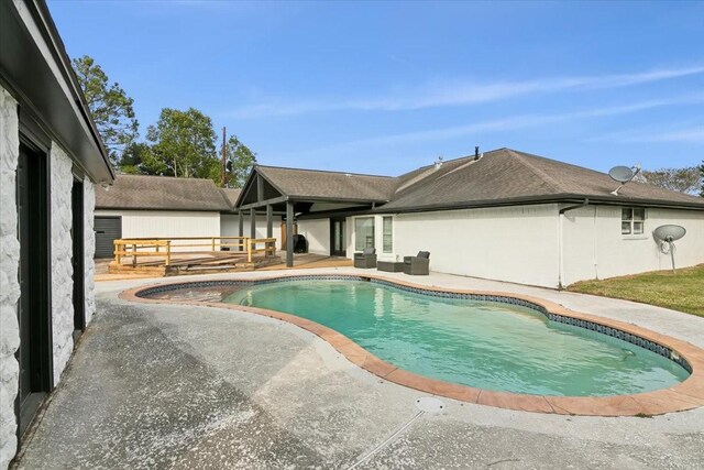 view of swimming pool with a patio