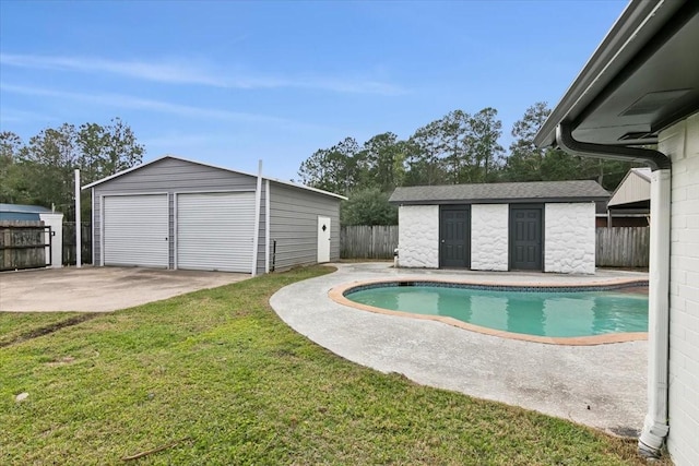 view of pool with a patio area, a storage shed, and a yard