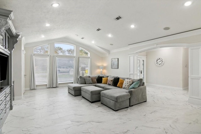 living room featuring decorative columns, a textured ceiling, lofted ceiling, and ornamental molding