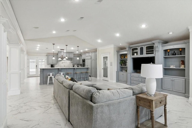 living room with french doors, vaulted ceiling, and ornamental molding