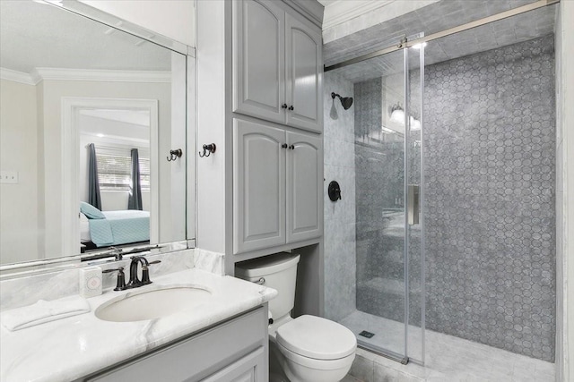 bathroom featuring vanity, toilet, an enclosed shower, and ornamental molding