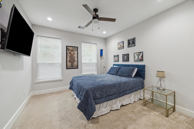 bedroom with light carpet and ceiling fan