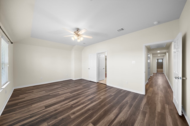 spare room featuring ceiling fan and dark hardwood / wood-style flooring