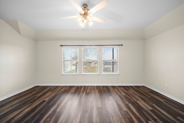 empty room featuring dark hardwood / wood-style flooring and ceiling fan