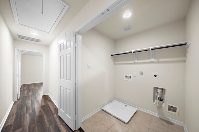 washroom with washer hookup, gas dryer hookup, electric dryer hookup, and wood-type flooring