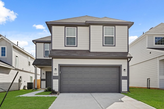 view of front facade with driveway, a garage, a shingled roof, cooling unit, and a front lawn