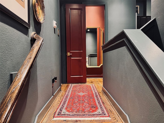 hall with light hardwood / wood-style floors