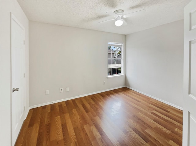 empty room featuring hardwood / wood-style floors, a textured ceiling, and ceiling fan