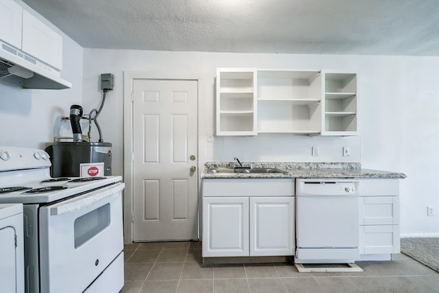 kitchen with white appliances, white cabinets, gas water heater, sink, and a textured ceiling