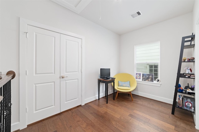 living area with hardwood / wood-style flooring