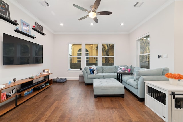 living room with crown molding, ceiling fan, and wood-type flooring