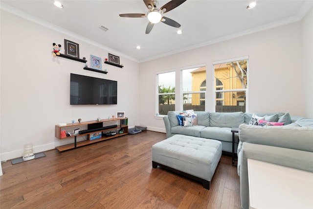 living room with dark hardwood / wood-style floors, ceiling fan, and ornamental molding