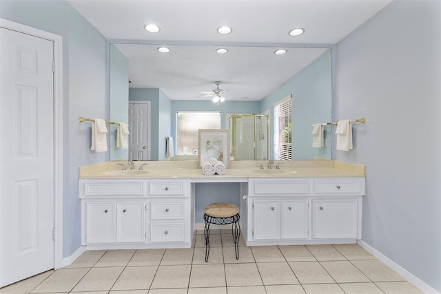 bathroom featuring tile patterned floors, ceiling fan, an enclosed shower, and vanity