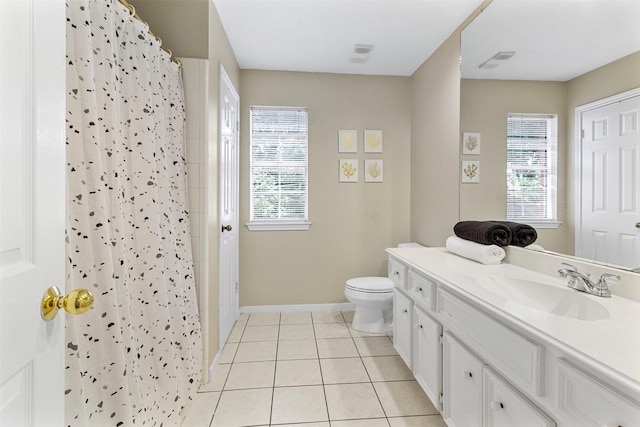 bathroom with tile patterned floors, curtained shower, and a healthy amount of sunlight