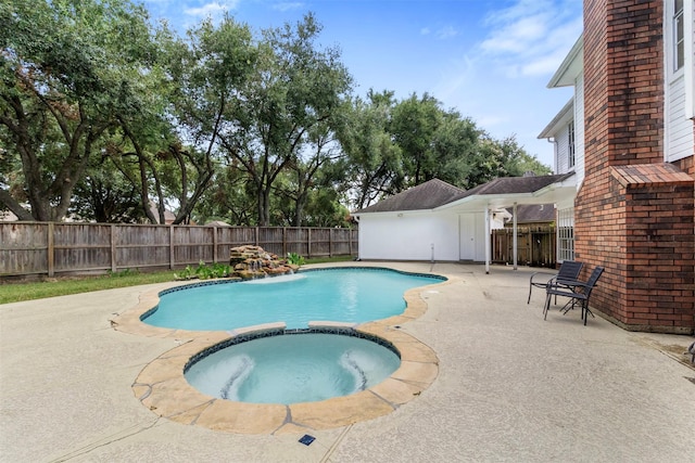 view of pool featuring an in ground hot tub and a patio