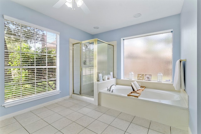 bathroom featuring plus walk in shower, tile patterned floors, a wealth of natural light, and ceiling fan